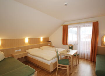 Double bed with sofa bed and balcony in the Mitterberg flat