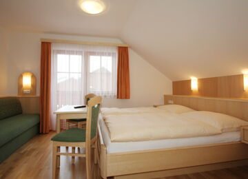 Double bed with sofa bed and balcony in the Mitterberg flat